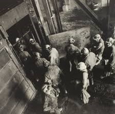 A group of miners going into a mine shaft