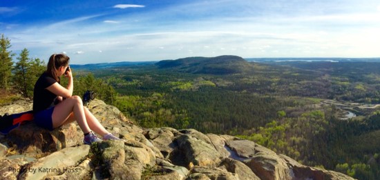 Girl sitting on Mount Cheminis Summit