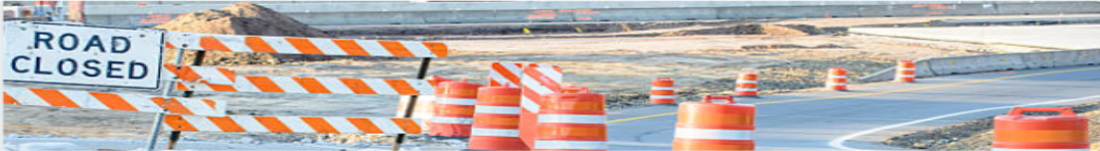 Highway with a barrier across it saying Road Closed