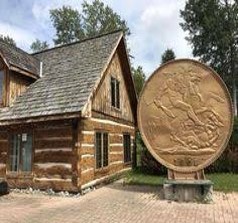 Outside of Tourist Center with big gold coin